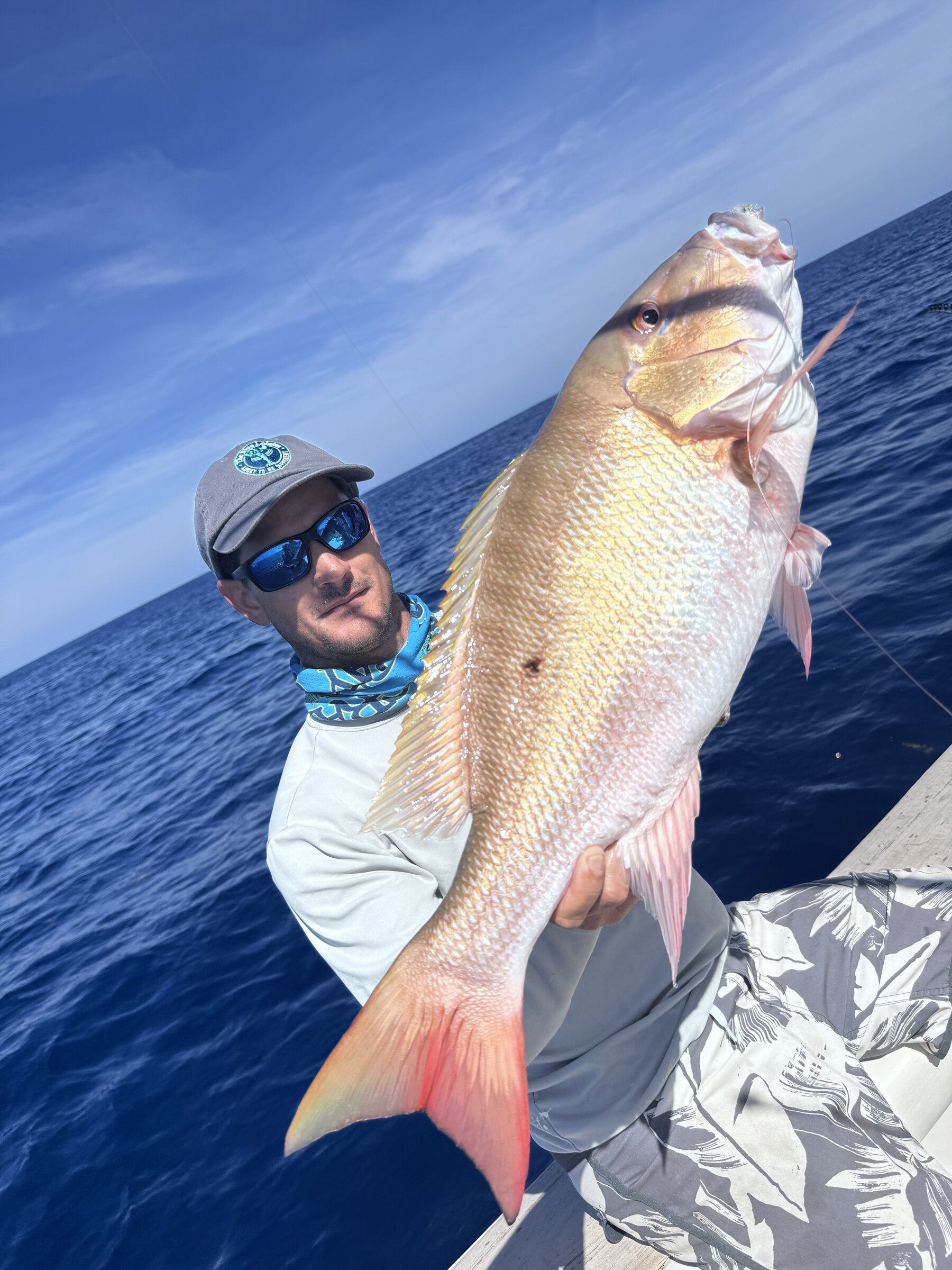 The captain holding a mutton snapper